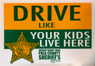 Drive Like Your Kids Live here sign